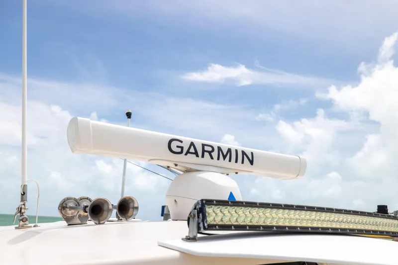 Slide: The Image of Garmin radar on 2021 Grady-White Canyon 376 boat under clear sky. - 11