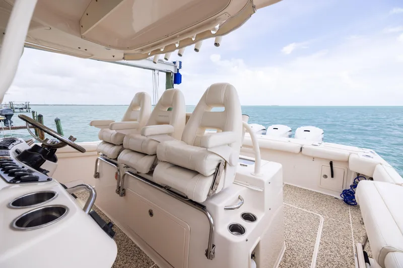 Slide: The Image of 2021 Grady-White Canyon 376 boat interior with luxurious seating and ocean view. - 14