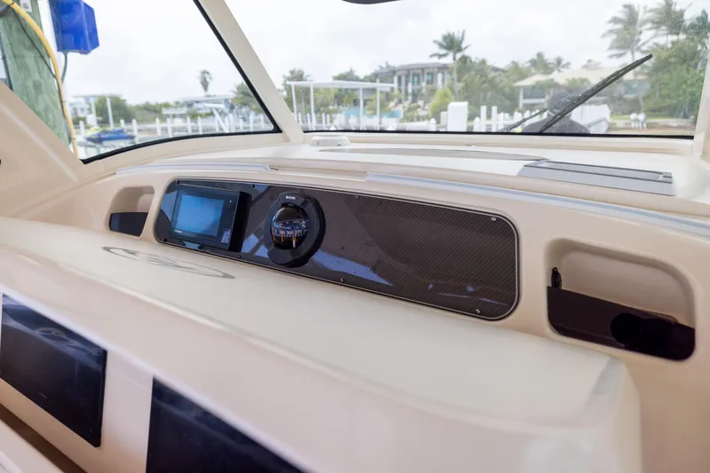 Slide: The Image of 2021 Grady-White Canyon 376 boat dashboard with navigation instruments and display. - 19