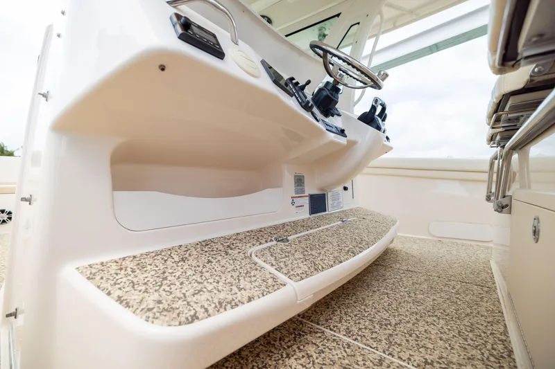 Slide: The Image of 2021 Grady-White Canyon 376 boat helm with steering wheel and controls. - 20