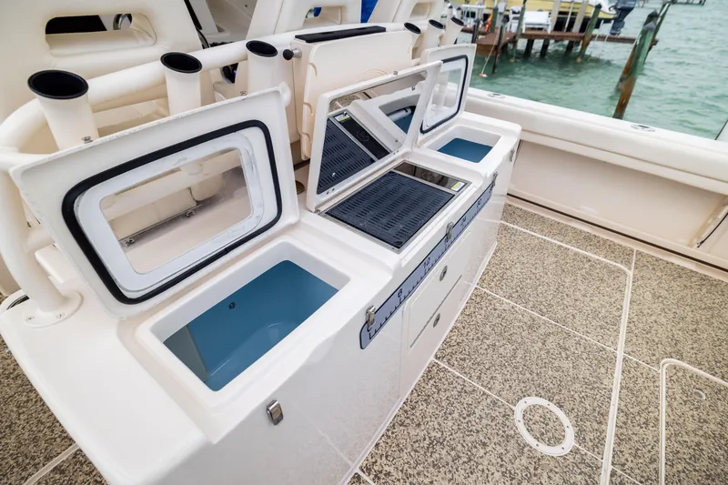 Slide: The Image of 2021 Grady-White Canyon 376 fishing station with storage and rod holders, dockside view. - 24