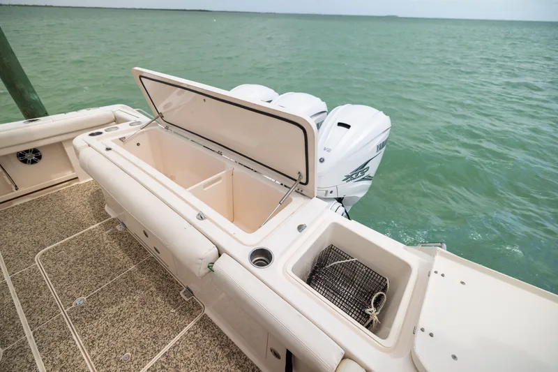 Slide: The Image of 2021 Grady-White Canyon 376 boat with open storage, triple engines, and ocean view. - 28