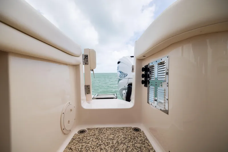 Slide: The Image of 2021 Grady-White Canyon 376 boat interior with ocean view and Yamaha XTO engine. - 31
