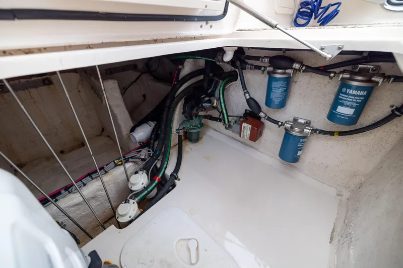 Slide: The Image of 2021 Grady-White Canyon 376 engine compartment with Yamaha fuel filters and wiring. - 33