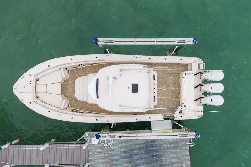 Slide: The Image of Overhead view of 2021 Grady-White Canyon 376 boat docked in turquoise water. - 5