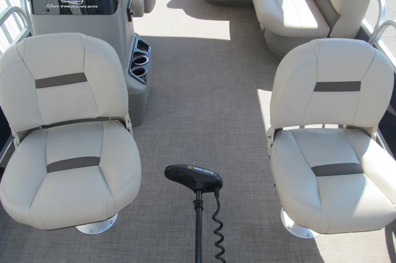 Slide: The Image of 2023 Sun Tracker Bass Buggy 18 DLX interior with comfortable seating and steering console. - 10