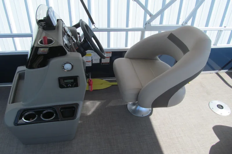 Slide: The Image of 2023 Sun Tracker Bass Buggy 18 DLX helm with comfortable captain's chair and control panel. - 12