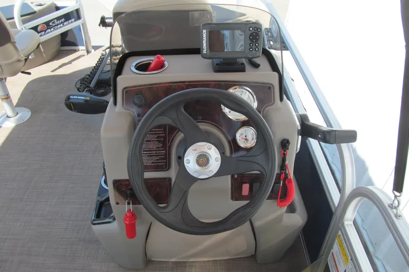 Slide: The Image of 2023 Sun Tracker Bass Buggy 18 DLX steering console with gauges and fish finder. - 6
