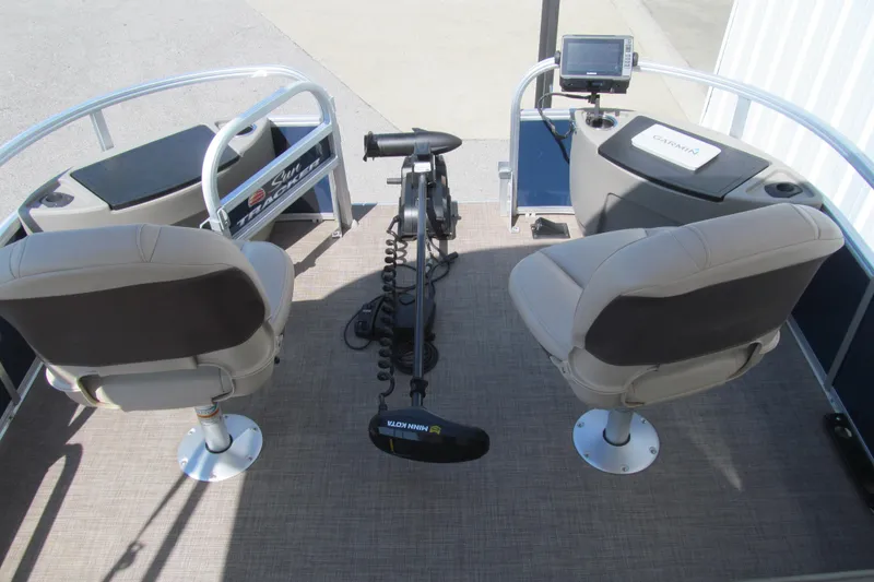 Slide: The Image of 2023 Sun Tracker Bass Buggy 18 DLX interior with seating and fishing equipment. - 7