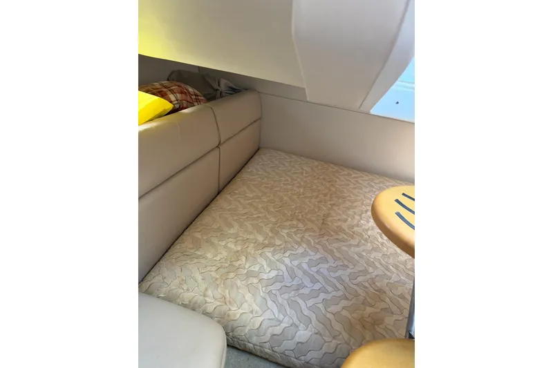 Slide: The Image of Interior cabin of 2016 Formula 350 Crossover Bowrider I/O with cushioned seating. - 16