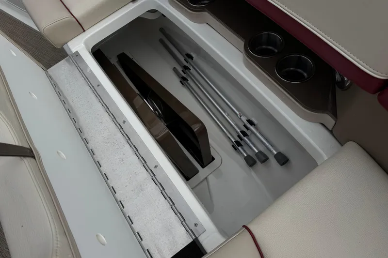 Slide: The Image of Storage compartment in a 2016 Formula 350 Crossover Bowrider I/O boat, featuring cup holders. - 21