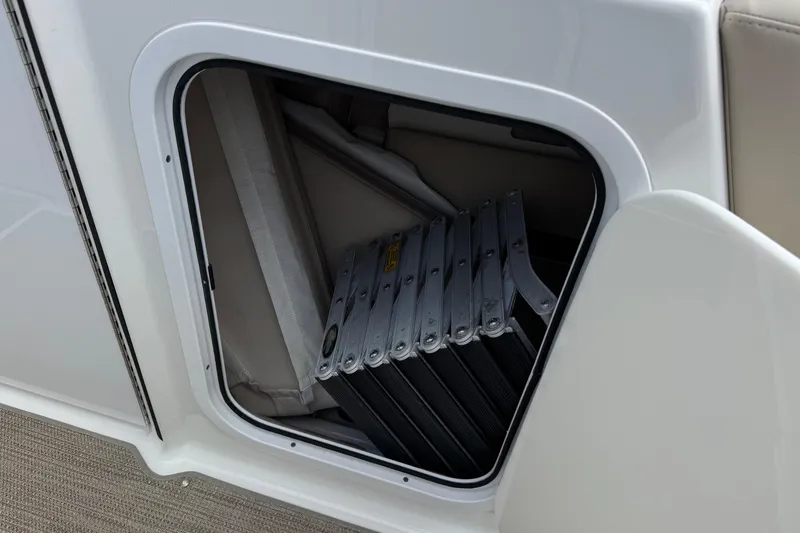 Slide: The Image of Storage compartment with folded ladder on 2016 Formula 350 Crossover Bowrider I/O boat. - 23