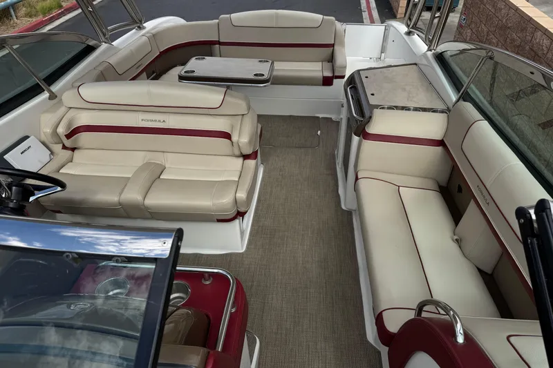 Slide: The Image of 2016 Formula 350 Crossover Bowrider I/O interior with luxurious seating and table setup. - 28