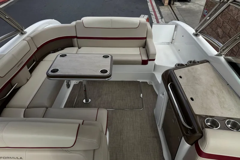 Slide: The Image of 2016 Formula 350 Crossover Bowrider I/O interior with seating and table setup. - 29