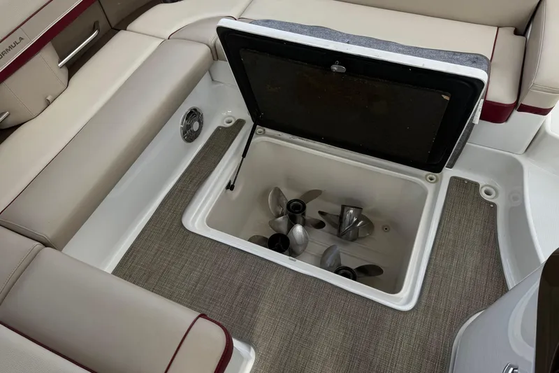 Slide: The Image of Storage compartment with propellers in a 2016 Formula 350 Crossover Bowrider I/O boat. - 30
