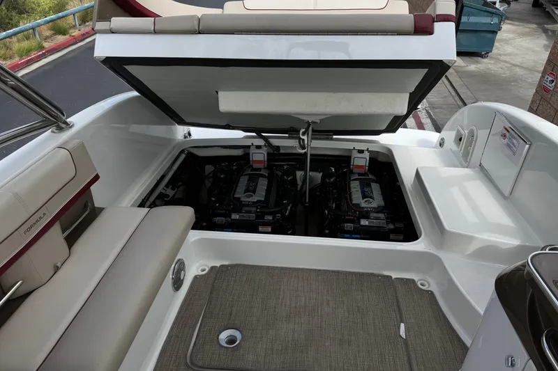 Slide: The Image of 2016 Formula 350 Crossover Bowrider I/O engine compartment with open hatch, showcasing dual engines. - 31