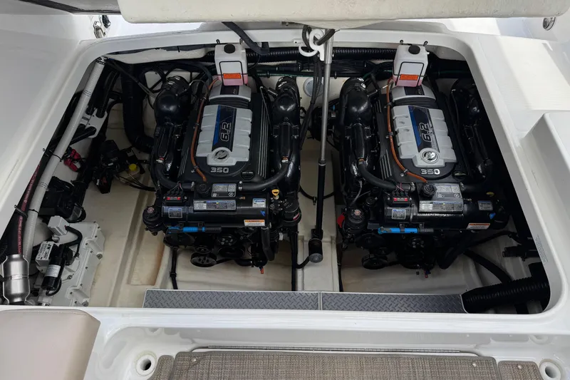 Slide: The Image of Engine compartment of a 2016 Formula 350 Crossover Bowrider I/O, featuring dual 6.2L engines. - 32