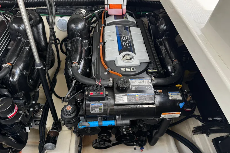 Slide: The Image of Engine compartment of a 2016 Formula 350 Crossover Bowrider I/O, featuring a 6.2L engine. - 34
