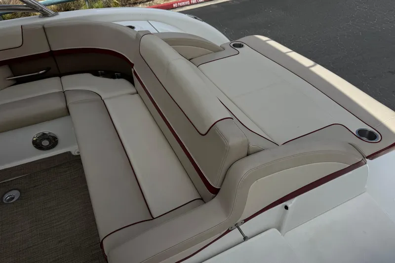 Slide: The Image of 2016 Formula 350 Crossover Bowrider I/O interior seating with beige upholstery and cup holders. - 37