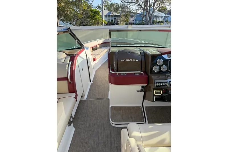 Slide: The Image of 2016 Formula 350 Crossover Bowrider I/O interior with dashboard and seating area. - 4