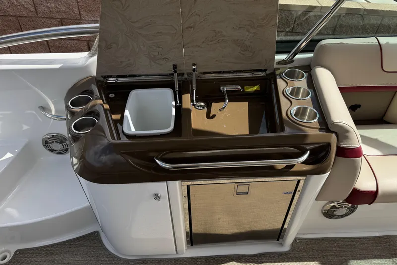 Slide: The Image of 2016 Formula 350 Crossover Bowrider I/O boat interior with sink and cup holders. - 40