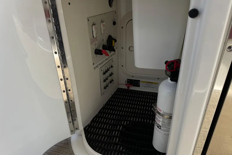 Slide: The Image of Control panel and fire extinguisher inside 2016 Formula 350 Crossover Bowrider I/O boat. - 42