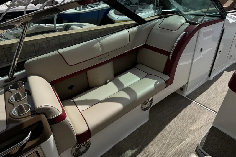Slide: The Image of 2016 Formula 350 Crossover Bowrider I/O interior with beige and red seating, cup holders. - 44