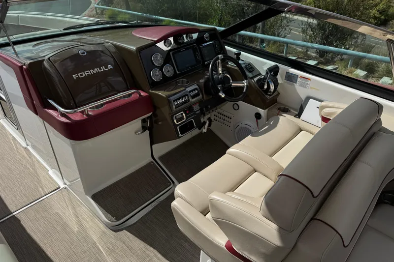 Slide: The Image of 2016 Formula 350 Crossover Bowrider I/O cockpit with luxurious seating and advanced controls. - 48