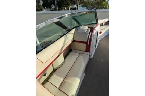 Slide: The Image of 2016 Formula 350 Crossover Bowrider I/O interior with beige and red seating. - 5