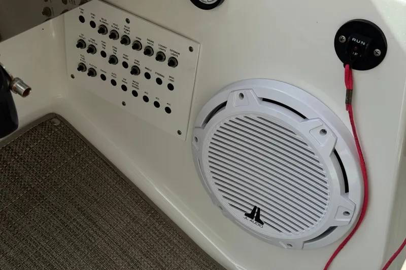 Slide: The Image of Control panel and speaker on a 2016 Formula 350 Crossover Bowrider I/O boat. - 53