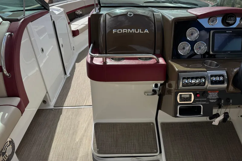 Slide: The Image of 2016 Formula 350 Crossover Bowrider I/O dashboard with gauges and controls. - 54