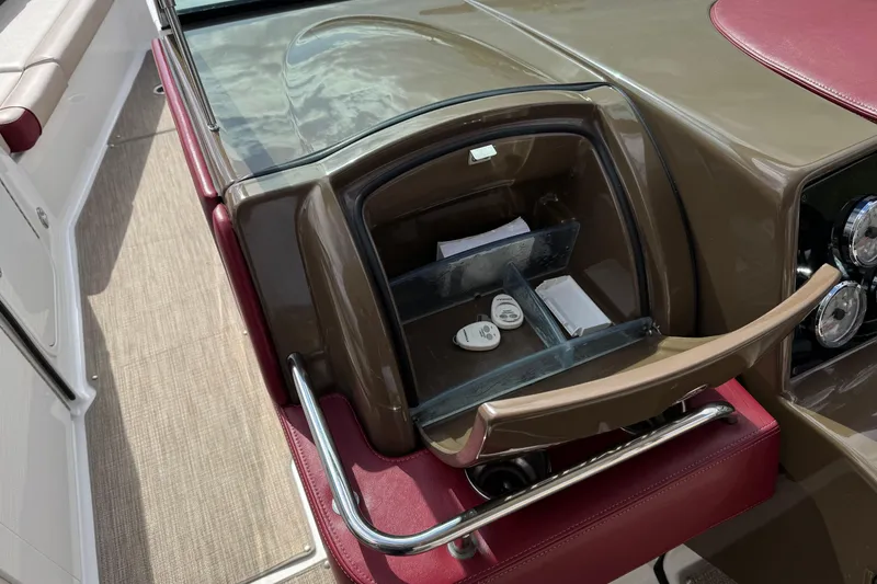 Slide: The Image of 2016 Formula 350 Crossover Bowrider I/O dashboard with storage compartment and controls. - 55