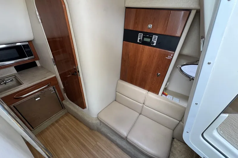 Slide: The Image of Interior of 2016 Formula 350 Crossover Bowrider I/O with kitchenette and seating area. - 58