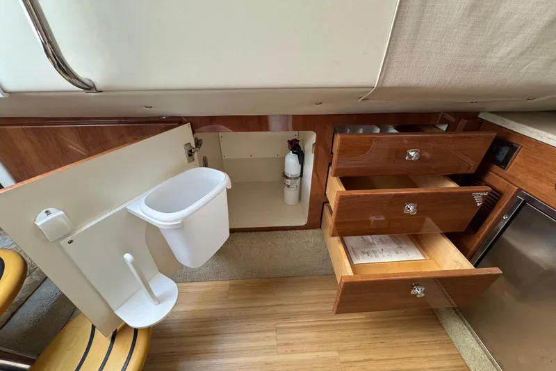 Slide: The Image of Interior of 2016 Formula 350 Crossover Bowrider I/O with open drawers and storage. - 61