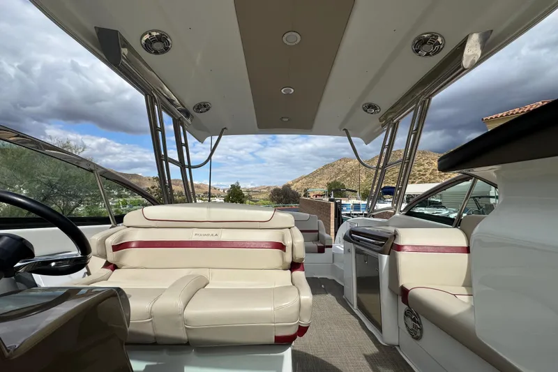 Slide: The Image of 2016 Formula 350 Crossover Bowrider I/O interior with beige seating and scenic view. - 64
