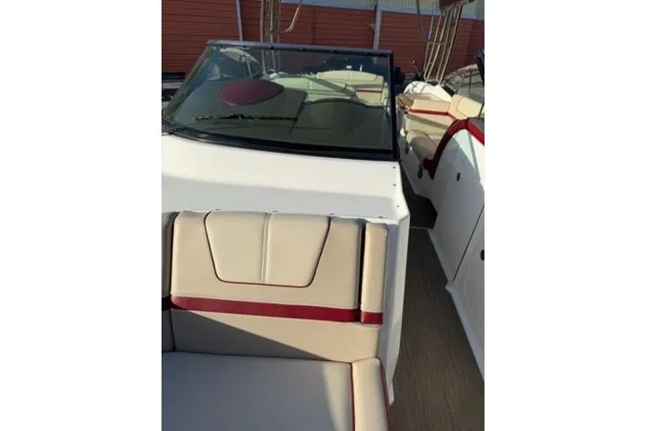 Slide: The Image of 2016 Formula 350 Crossover Bowrider I/O with beige and red interior seating. - 8