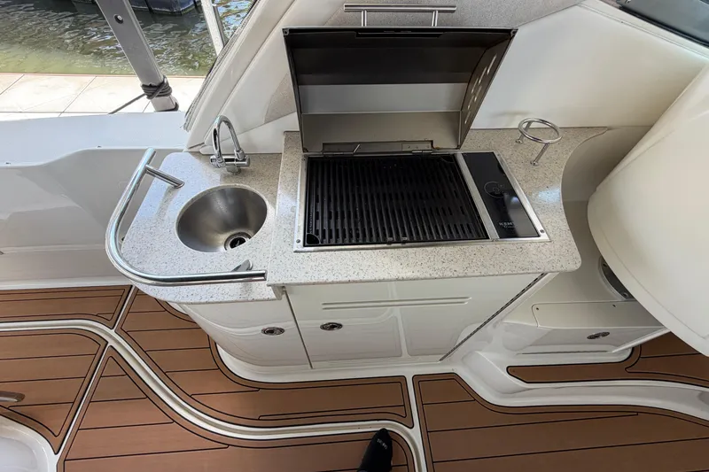 Slide: The Image of Outdoor kitchenette on 2008 Sea Ray Sundancer 330 with grill and sink. - 15