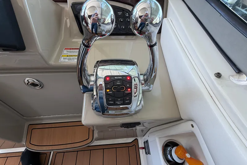 Slide: The Image of Control panel of a 2008 Sea Ray Sundancer 330 boat with dual throttle levers. - 18