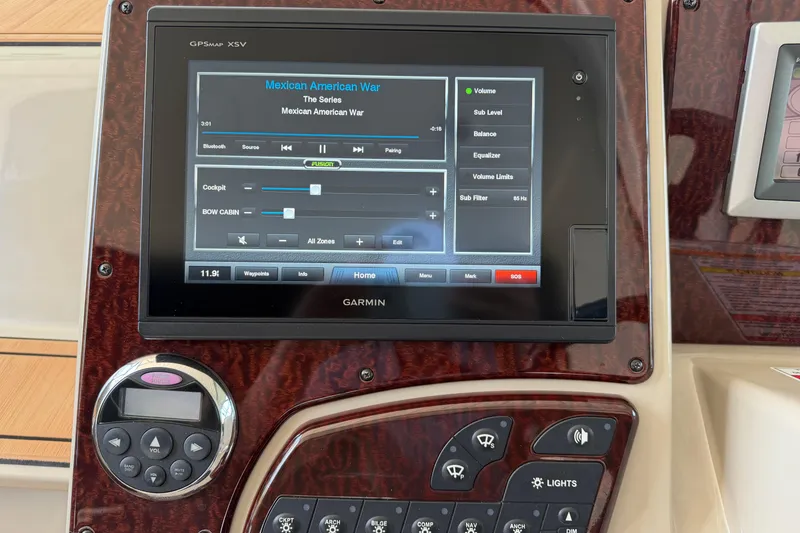 Slide: The Image of Garmin GPS display on 2008 Sea Ray Sundancer 330 boat dashboard, showing audio controls. - 22