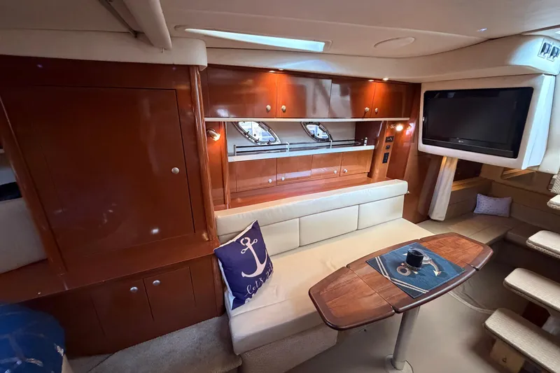 Slide: The Image of Luxurious interior of 2008 Sea Ray Sundancer 330 yacht with elegant wood finishes and cozy seating. - 24