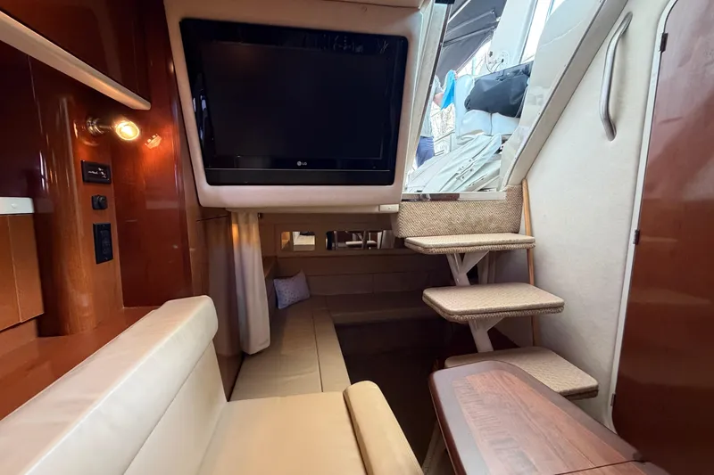 Slide: The Image of Interior of 2008 Sea Ray Sundancer 330 with TV, seating, and stairs. - 25