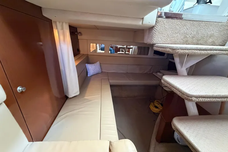 Slide: The Image of Interior of 2008 Sea Ray Sundancer 330 yacht with beige seating and carpeted stairs. - 28