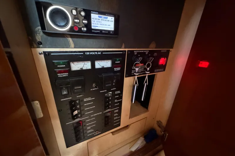 Slide: The Image of Control panel of a 2008 Sea Ray Sundancer 330 boat, featuring electrical switches and gauges. - 29