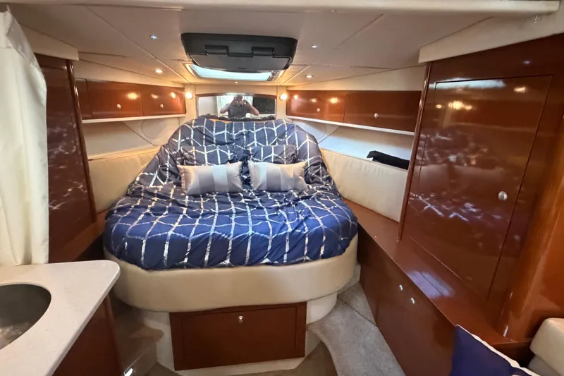 Slide: The Image of Interior cabin of 2008 Sea Ray Sundancer 330 with cozy bed and elegant wood finish. - 32