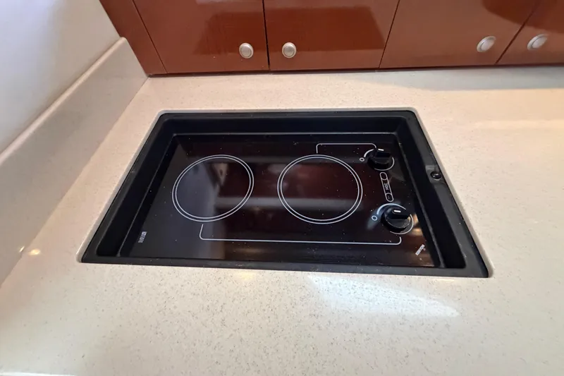 Slide: The Image of Stovetop in 2008 Sea Ray Sundancer 330 yacht kitchen, featuring sleek design and modern controls. - 33