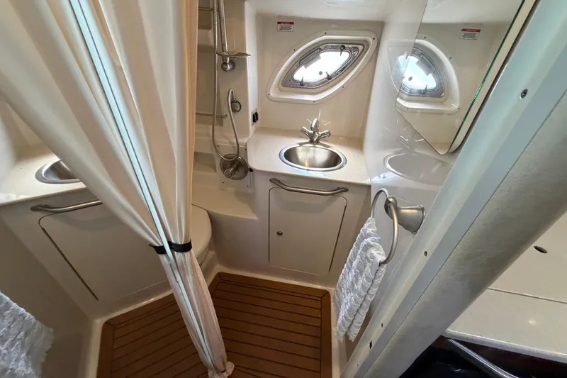 Slide: The Image of 2008 Sea Ray Sundancer 330 bathroom with sink, shower, and wooden floor. - 34