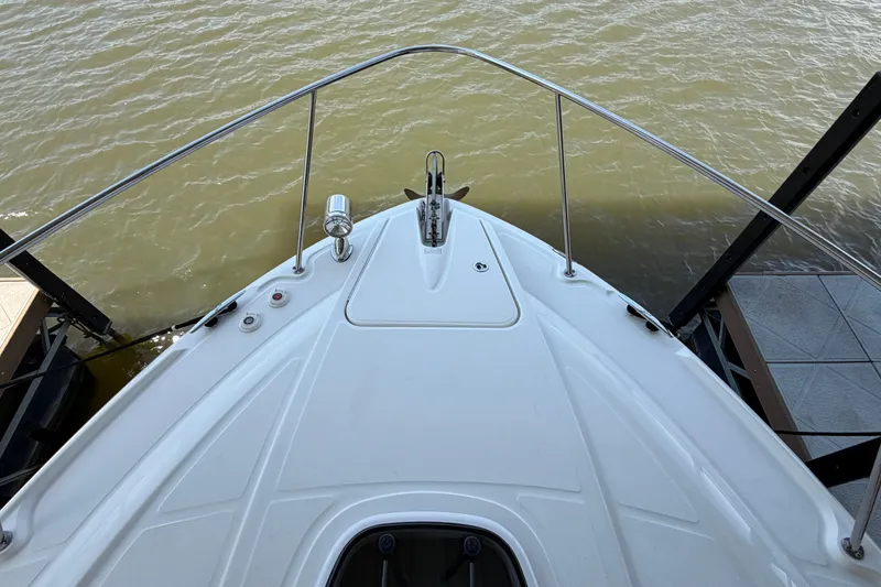 Slide: The Image of Bow view of 2008 Sea Ray Sundancer 330 docked on calm water. - 7
