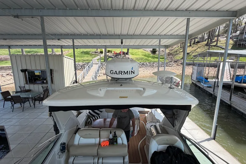 Slide: The Image of 2008 Sea Ray Sundancer 330 docked under covered marina with Garmin equipment. - 8