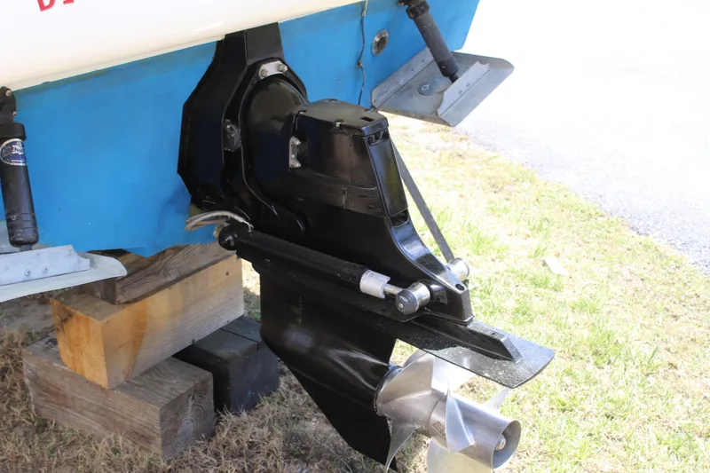 Slide: The Image of 2011 Sea Ray Sundancer 260 boat outdrive and propeller on wooden blocks. - 10