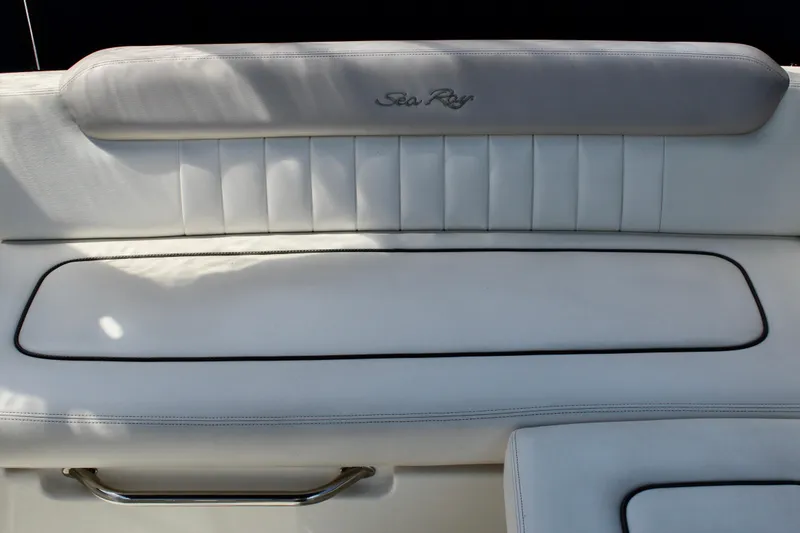 Slide: The Image of White leather seating on a 2011 Sea Ray Sundancer 260 boat. - 11